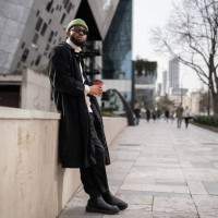carefree calm black man near modern building with cup of coffee good morning free from work and duty - fashion stock pictures, royalty-free photos & images