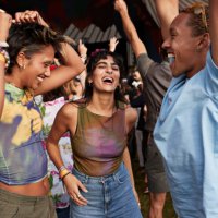 carefree festival goers dancing while enjoying at concert - concert stock pictures, royalty-free photos & images