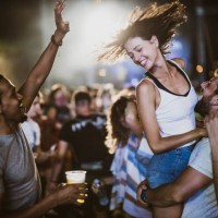 carefree friends having fun on music festival by night. - concert stock pictures, royalty-free photos & images
