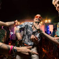 carefree man dancing with his friends on music concert by night. - concert stock pictures, royalty-free photos & images