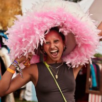 carefree woman wearing pink hat while shouting - concert stock pictures, royalty-free photos & images