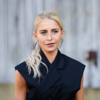 Caroline Daur wears silver earrings, a sleeveless double breasted blazer jacket , outside COS, during New York Fashion Week, on September 10, 2024 in...
