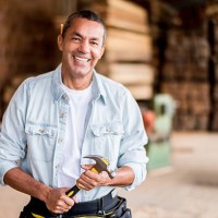 carpenter at the carpentry holding tools - home decoration stock pictures, royalty-free photos & images