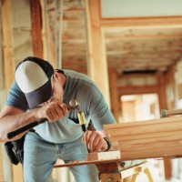 carpenter chiseling out wood at home renovation site - home decoration stock pictures, royalty-free photos & images