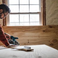 carpenter cutting a piece of plywood - home decoration stock pictures, royalty-free photos & images