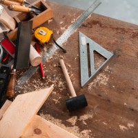 carpenter tools,hammer,meter,nails,shavings, and chisel over wood table - home decoration stock pictures, royalty-free photos & images