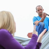 caucasian homeowner signing to deaf roofer - home decoration stock pictures, royalty-free photos & images