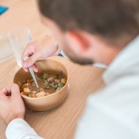 caucasian male eating take out in corporate office - junk food stock pictures, royalty-free photos & images