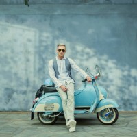 caucasian man sitting on vintage scooter - fashion stock pictures, royalty-free photos & images