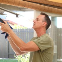 caulking gun man horizontal - home decoration stock pictures, royalty-free photos & images
