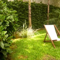 chair alone in green park - garden decoration stock pictures, royalty-free photos & images