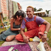 cheerful couple sitting with tarot cards at park - concert stock pictures, royalty-free photos & images