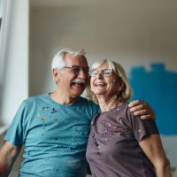 cheerful embraced senior couple during home renovation process. - home decoration stock pictures, royalty-free photos & images