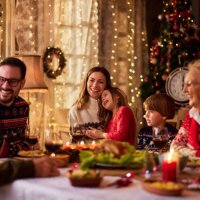 cheerful extended family talking during christmas dinner at home. - food stock pictures, royalty-free photos & images