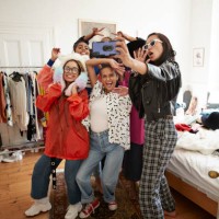cheerful female friends gesturing while taking selfie - fashion photos et images de collection