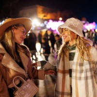 cheerful female friends having fun in amusement park in the evening - concert stock pictures, royalty-free photos & images