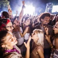 cheerful friends dancing and signing on music festival by night. - concert stock pictures, royalty-free photos & images