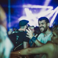 cheerful friends dancing and singing on a music festival by night. - concert stock pictures, royalty-free photos & images