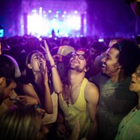 cheerful friends dancing on a music festival by night. - concert stock pictures, royalty-free photos & images