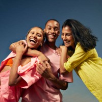 cheerful friends laughing against sky - fashion stock pictures, royalty-free photos & images