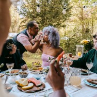 cheerful friends of lgbtq community enjoying during party in back yard - garden decoration photos et images de collection