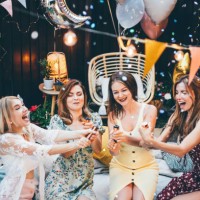 cheerful girl friends hanging out at backyard party. - garden decoration stock pictures, royalty-free photos & images