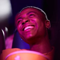 cheerful man at movie theater - fashion stock pictures, royalty-free photos & images