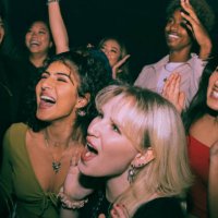 cheerful multiracial men and women shouting and dancing at nightclub - concert stock pictures, royalty-free photos & images