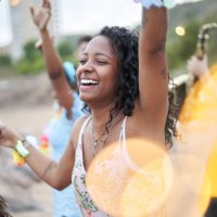 cheerful photo of an african american young woman dancing in a beach party in the summer season. - concert stock pictures, royalty-free photos & images