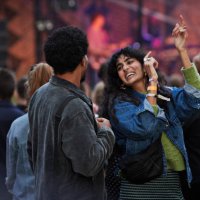 cheerful woman dancing with boyfriend - concert stock pictures, royalty-free photos & images