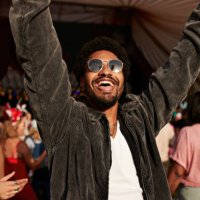 cheerful young man dancing with arms raised near girlfriend - concert stock pictures, royalty-free photos & images