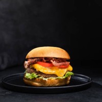 cheese burger with bacon on black dark background - junk food stock pictures, royalty-free photos & images