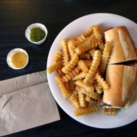 cheese steak sandwich with crinkle cut potato chips on a white plate at a diner in new york city, united states of america - junk food stock pictures, royalty-free photos & images