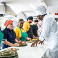 chef analyzing food prepared by students during cooking class - food stock pictures, royalty-free photos & images