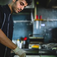 chef making pizza in restaurant kitchen - junk food stock pictures, royalty-free photos & images