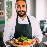 chef offers his prepared vegetarian pizza - food stock pictures, royalty-free photos & images