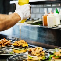 chef preparing artisan burgers - junk food stock pictures, royalty-free photos & images