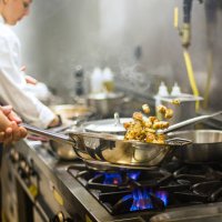 chef preparing cuisine in hotel kitchen - food stock pictures, royalty-free photos & images