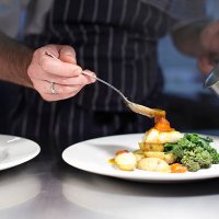 chef preparing dish in kitchen - food stock pictures, royalty-free photos & images