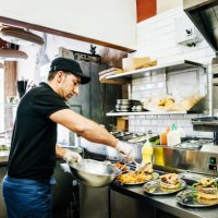 chef preparing food for customers - junk food stock pictures, royalty-free photos & images