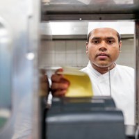 chef reviewing the order received from the restaurant - junk food stock pictures, royalty-free photos & images