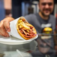 chef serving finished gyros - junk food stock pictures, royalty-free photos & images