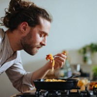 chef tasting pasta with fresh vegetables - food stock pictures, royalty-free photos & images