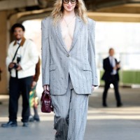 Chiara Ferragni wears crystals decorated grey suit, burgundy bag, white heels, outside Stella McCartney, during the Womenswear Fall/Winter 2025/2026...