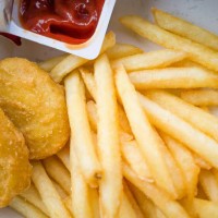 chicken nuggets and fries - junk food stock pictures, royalty-free photos & images