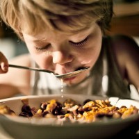 child eating cereal - food stock pictures, royalty-free photos & images