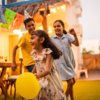 child friends running and playing with balloons during party at house yard - garden decoration stock pictures, royalty-free photos & images