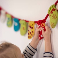 child opening advent calendar - home decoration stock pictures, royalty-free photos & images