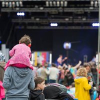 child wearing ear defenders at a scottish music festival - concert stock pictures, royalty-free photos & images