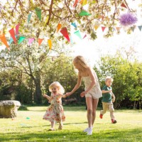 children (18-23 months, 4-5, 8-9) running in garden - garden decoration stock pictures, royalty-free photos & images